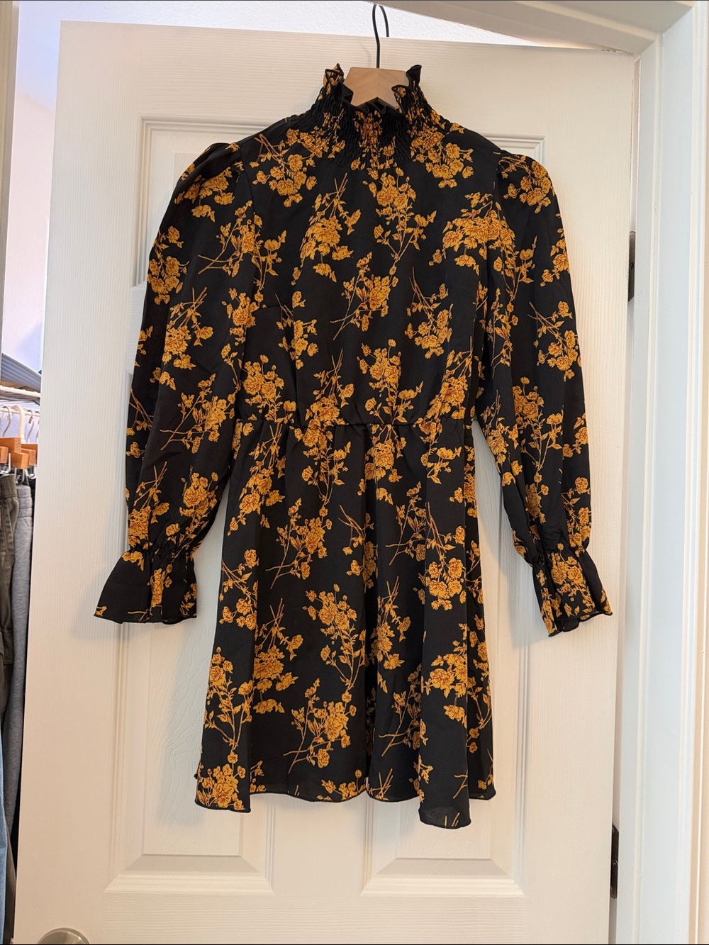 Long sleeve turtle neck sheer dress with golden brown floral and cinched waist